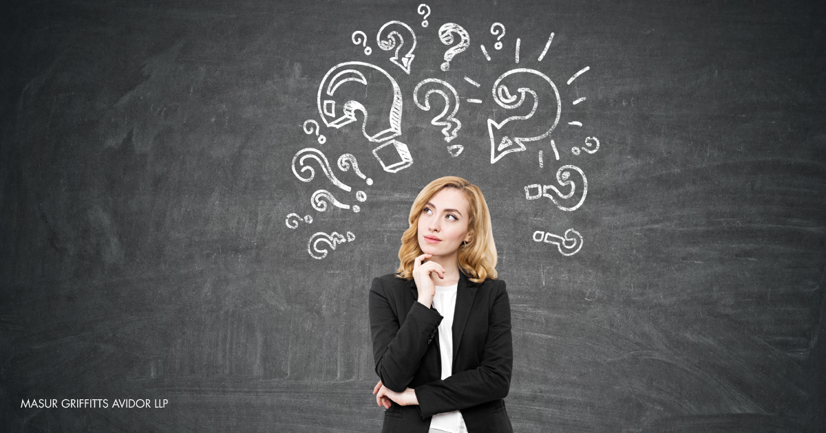 woman with question marks around her head